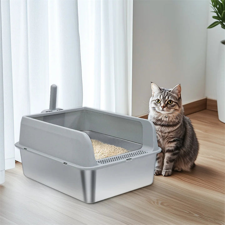 "Stainless steel cat litter box with easy front access and tall sides, ideal for hygienic pet spaces and easy maintenance."