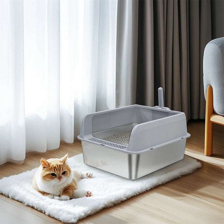 "Stainless steel cat litter box with easy front access and tall sides, ideal for hygienic pet spaces and easy maintenance."
