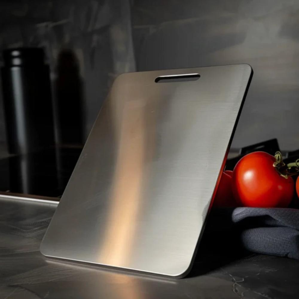 "Stainless steel cutting board, non-slip, scratch-resistant surface for hygienic food prep, sleek design for kitchen use."