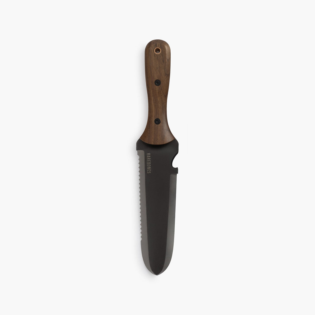 "Stainless steel Hori Hori garden tool with ergonomic walnut handle for digging and weeding in gardens."
