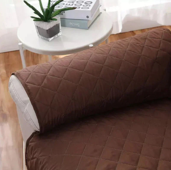 "Stretchable quilted recliner cover in grey, showcasing universal fit and plush, textured comfort for home seating protection