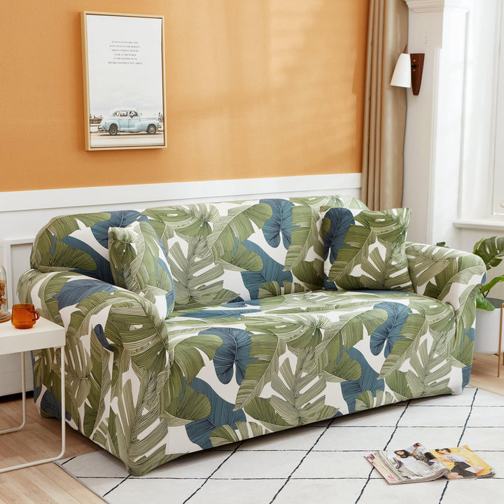 "Stretchy Split Leaf sofa cover with nature-inspired pattern fits various sofas, adds style, and offers protection against sp