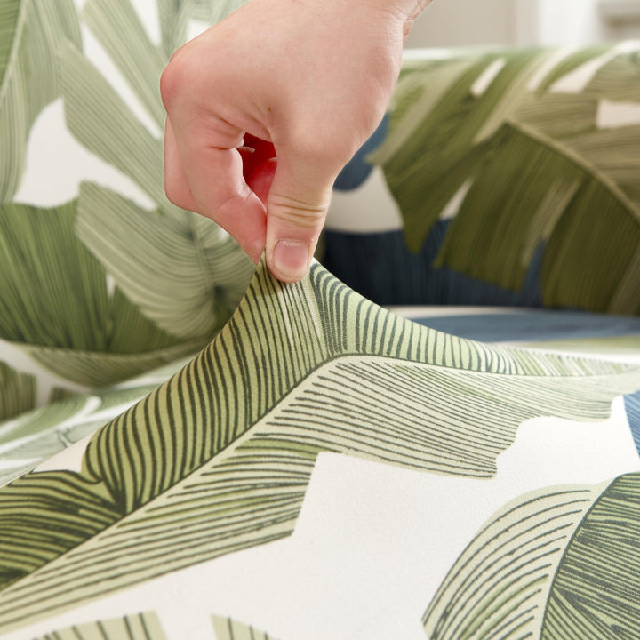 "Stretchy Split Leaf sofa cover with nature-inspired pattern fits various sofas, adds style, and offers protection against sp