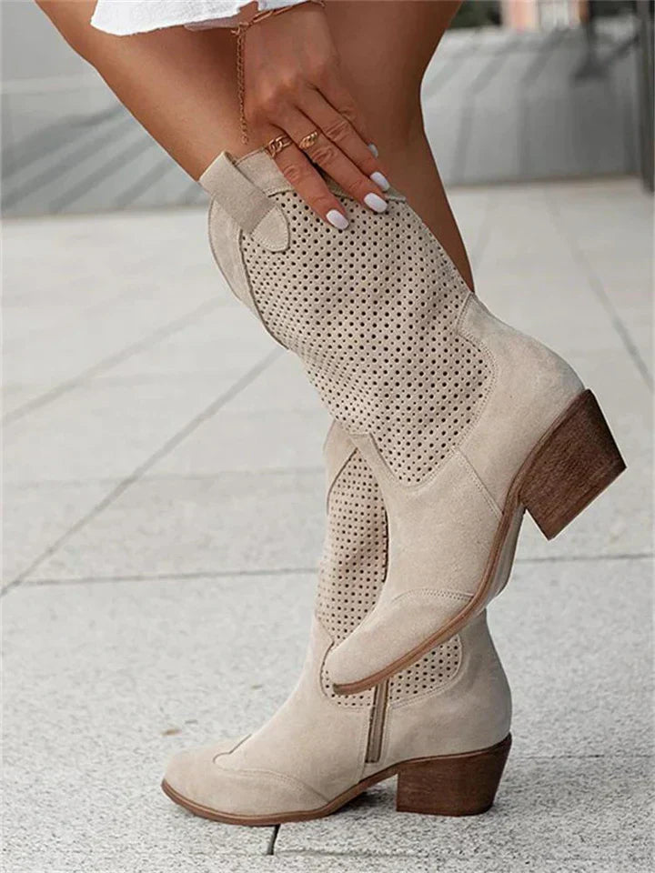 Stylish women's leather cowboy boots with intricate stitching and sleek silhouette enhance any look with a classic Western vi