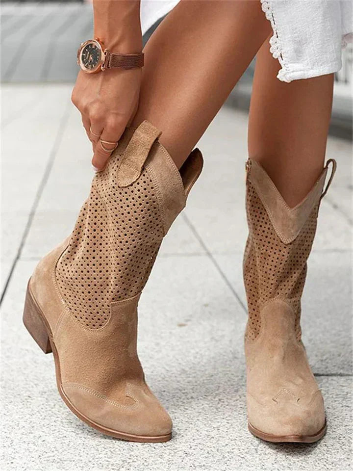 Stylish women's leather cowboy boots with intricate stitching and sleek silhouette enhance any look with a classic Western vi