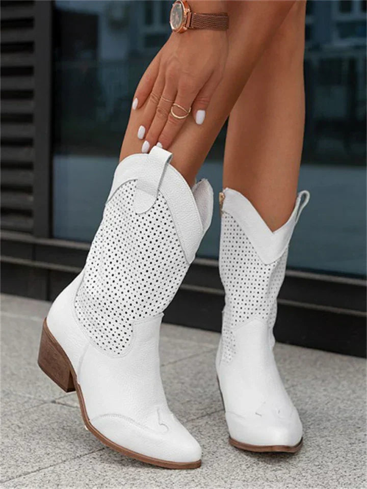 Stylish women's leather cowboy boots with intricate stitching and sleek silhouette enhance any look with a classic Western vi