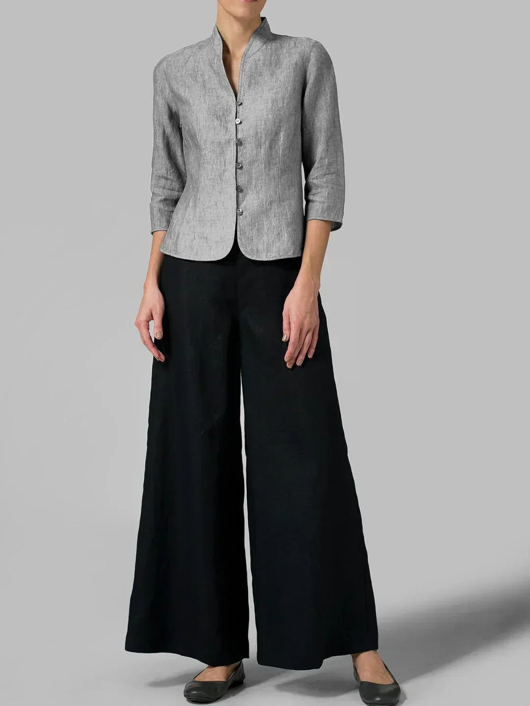 Stylish women's linen blazer with a tailored fit and mandarin collar, perfect for modern everyday elegance and versatility.