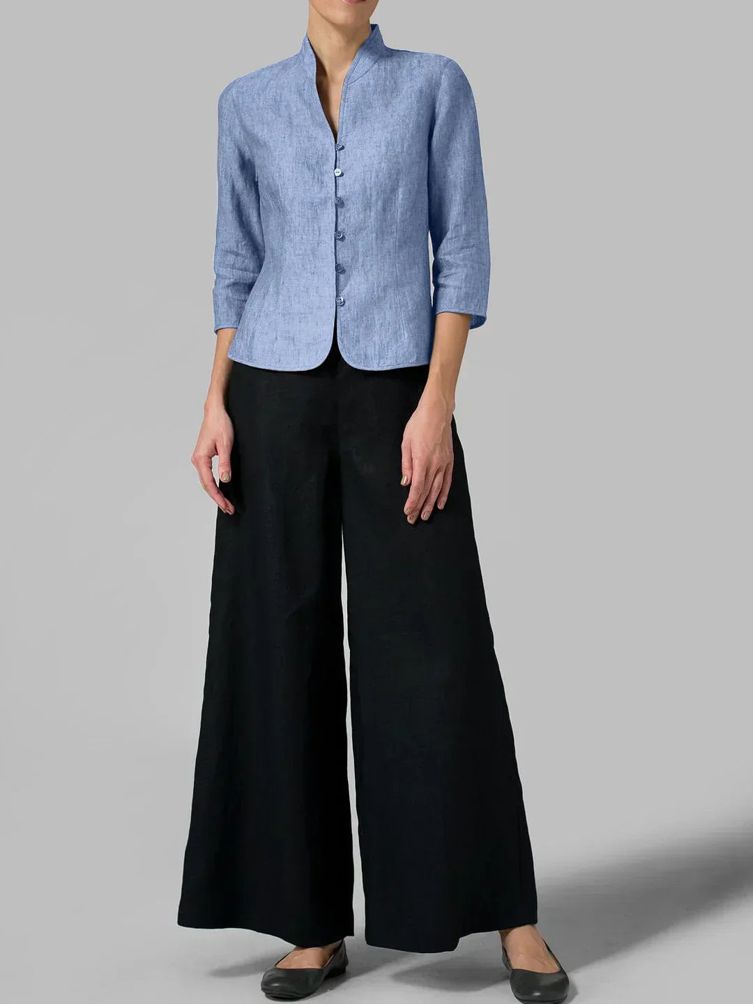 Stylish women's linen blazer with a tailored fit and mandarin collar, perfect for modern everyday elegance and versatility.