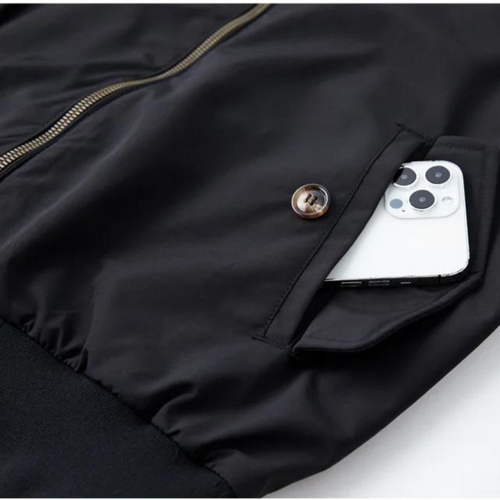"Tartan-lined Harrington jacket with ribbed cuffs and hem, featuring classic side view. Men's Camden Heritage style."