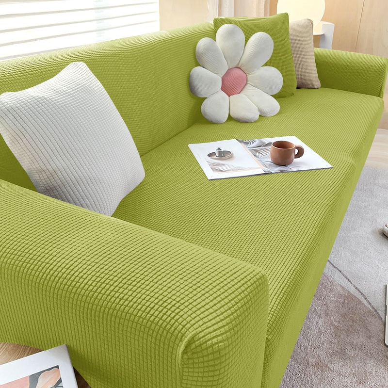 "Textured stretch sofa cover in beige, snug fit for sofas, non-slip, adds elegance, protects against spills and wear."
