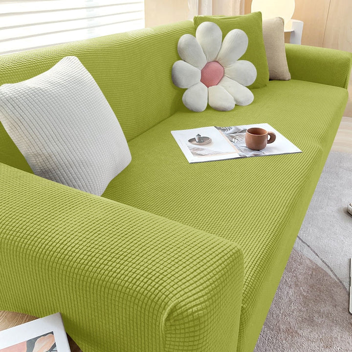 "Textured stretch sofa cover in beige, snug fit for sofas, non-slip, adds elegance, protects against spills and wear."
