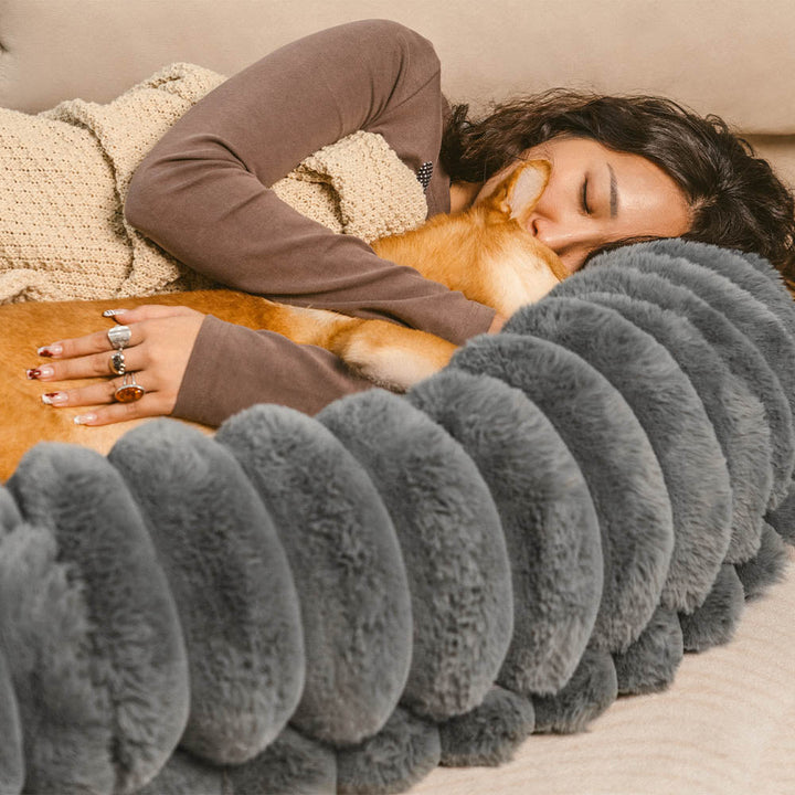 Ultra-soft large plush donut pet bed, creamy faux fur with bolsters for head support, fits humans and dogs, cozy design.