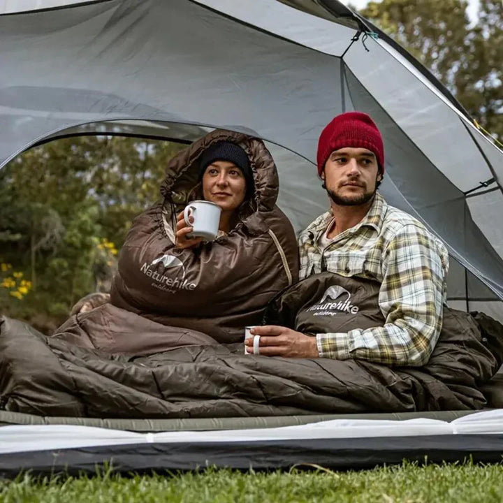 Ultralight women's insulated camping sleeping bag; lightweight, compact, blue fabric ideal for cold-weather adventures.