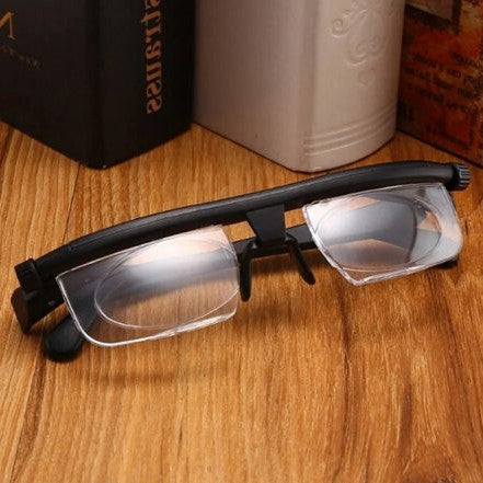 Unisex adjustable focus glasses with sleek design and polycarbonate frame for near and far sight, suited for any head size.