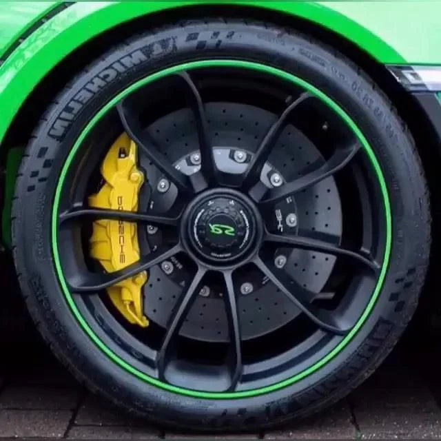 "Unisex alloy wheel rim protector, high adhesion, prevents kerb scrapes, vibrant colors, DIY installation, durable rubber."