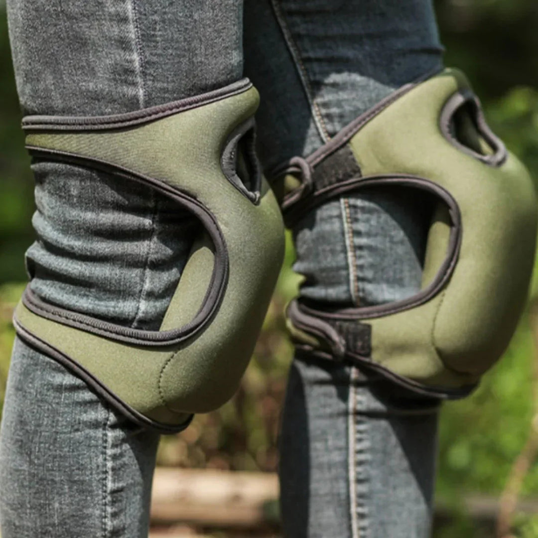Unisex ergonomic gardening knee pads with thick cushioning on green grass, offering comfort and support for kneeling tasks.