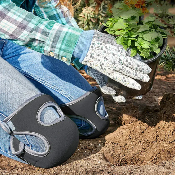 Unisex ergonomic gardening knee pads with thick cushioning on green grass, offering comfort and support for kneeling tasks.