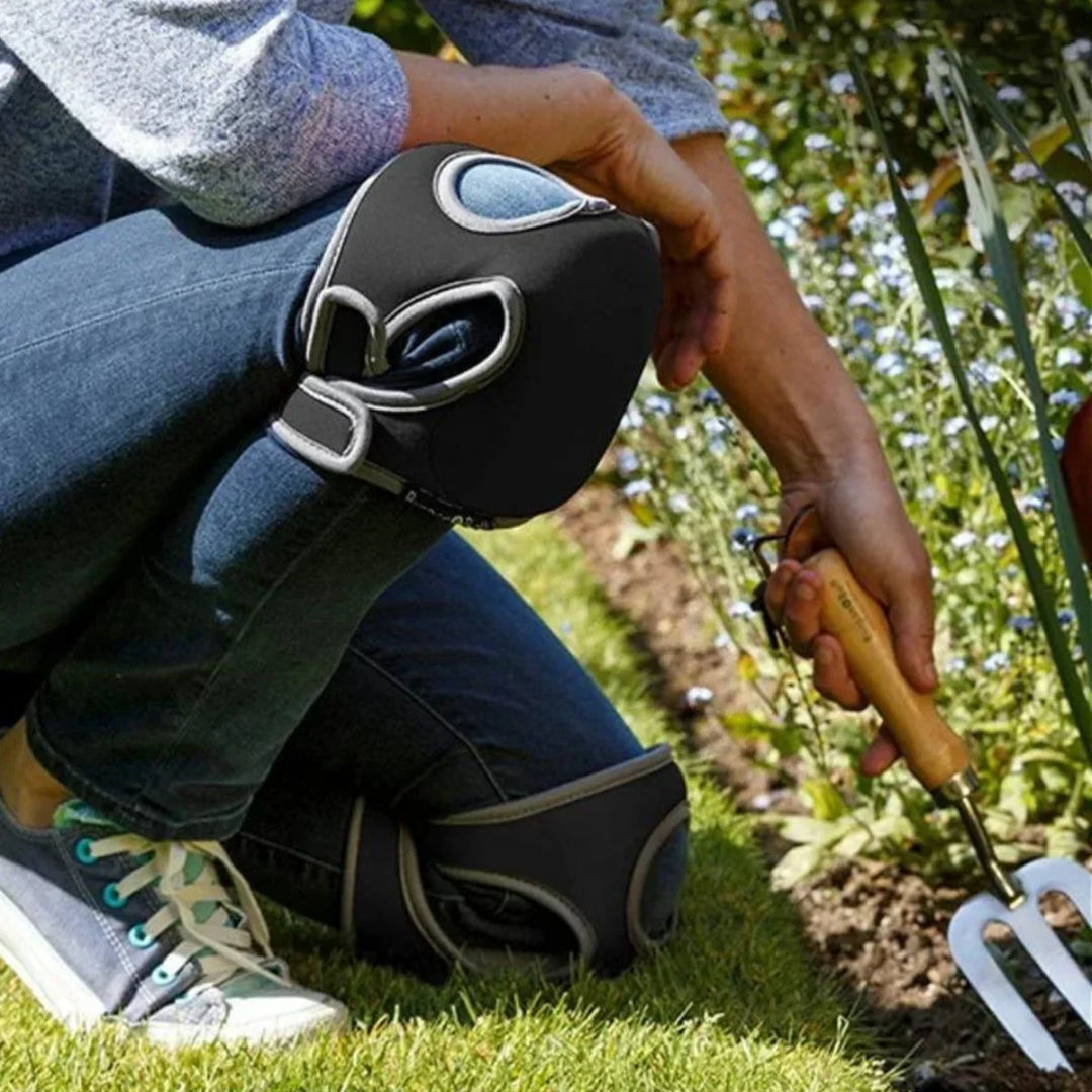 Unisex ergonomic gardening knee pads with thick cushioning on green grass, offering comfort and support for kneeling tasks.
