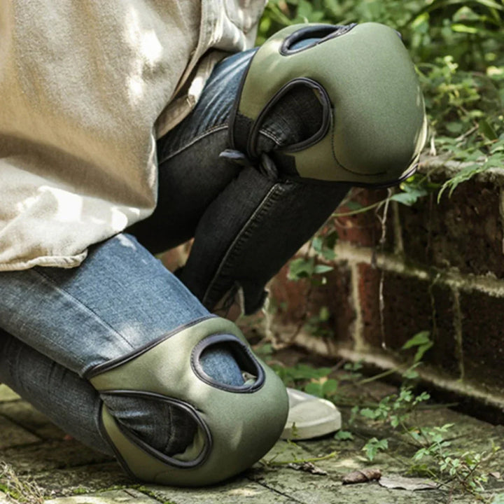 Unisex ergonomic gardening knee pads with thick cushioning on green grass, offering comfort and support for kneeling tasks.