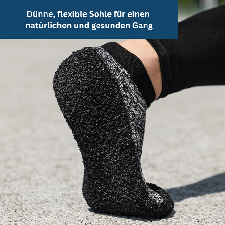 Unisex sock shoes for women, flexible and durable, gray with sleek design, offering comfort and support for everyday wear.