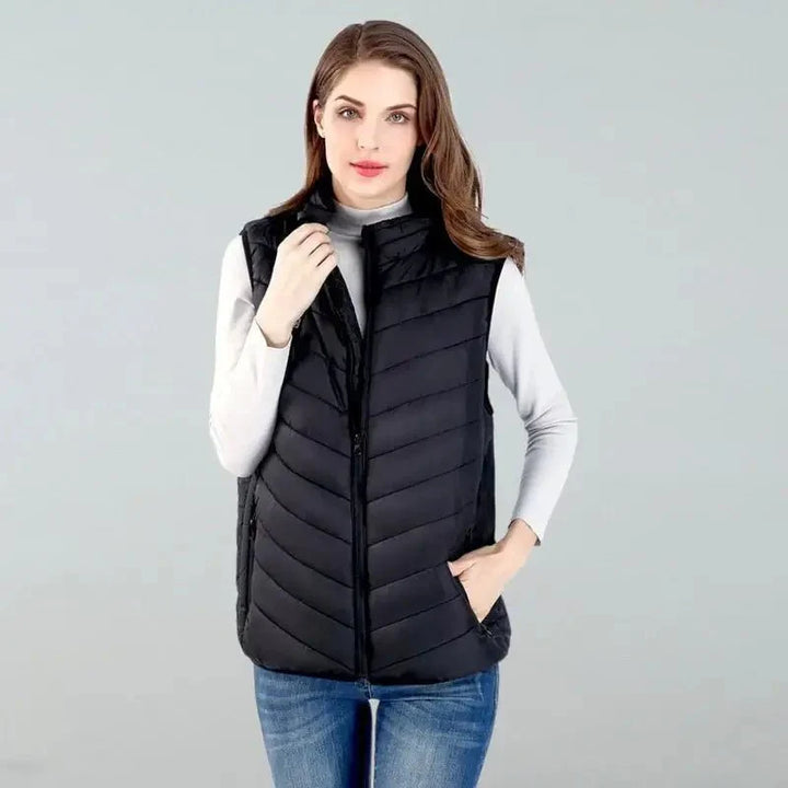 Unisex Thermo Heated Gilet front view; sleek black, advanced heating, ideal for cold weather, sports & fitness warmth.
