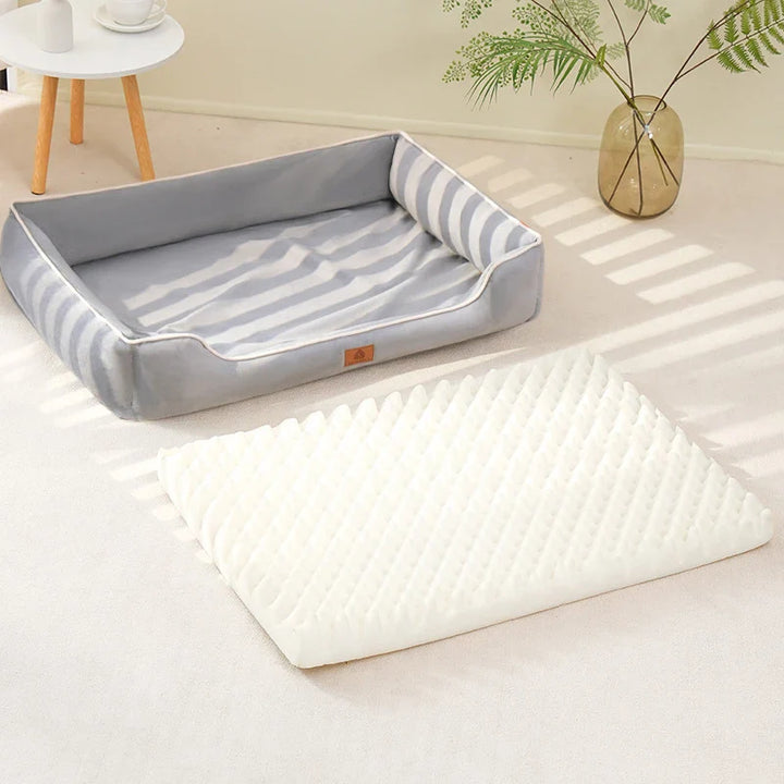 "Velvet-soft pet bed with cushion and bolster, shown in modern living room, offers comfort with Dutch velvet texture."