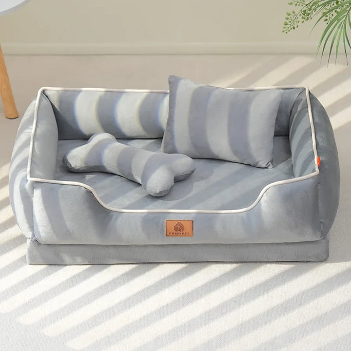 "Velvet-soft pet bed with cushion and bolster, shown in modern living room, offers comfort with Dutch velvet texture."