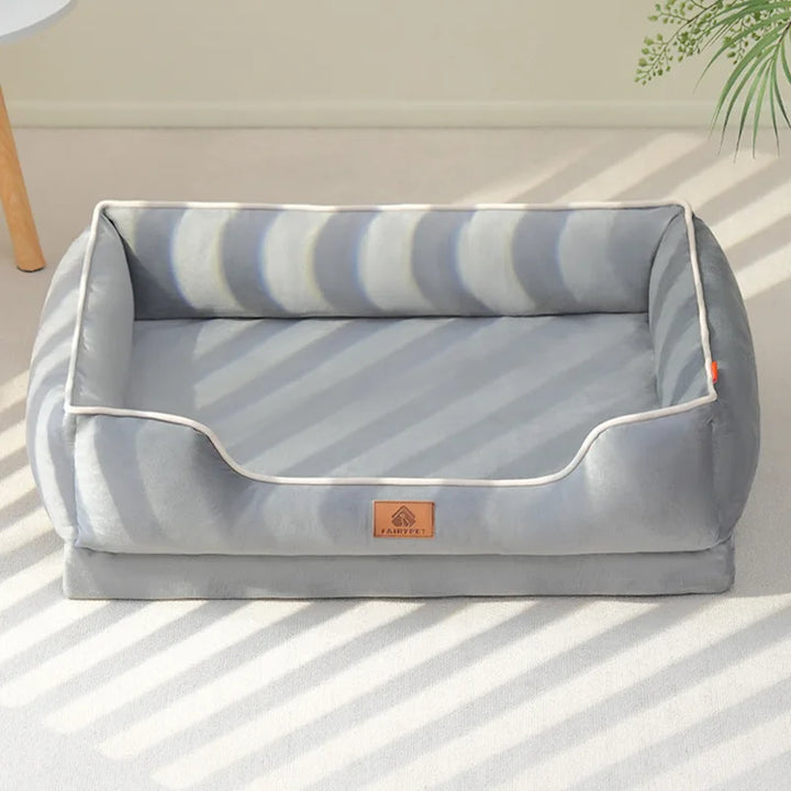 "Velvet-soft pet bed with cushion and bolster, shown in modern living room, offers comfort with Dutch velvet texture."