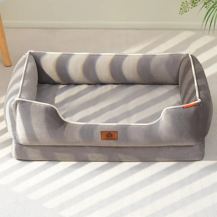 "Velvet-soft pet bed with cushion and bolster, shown in modern living room, offers comfort with Dutch velvet texture."