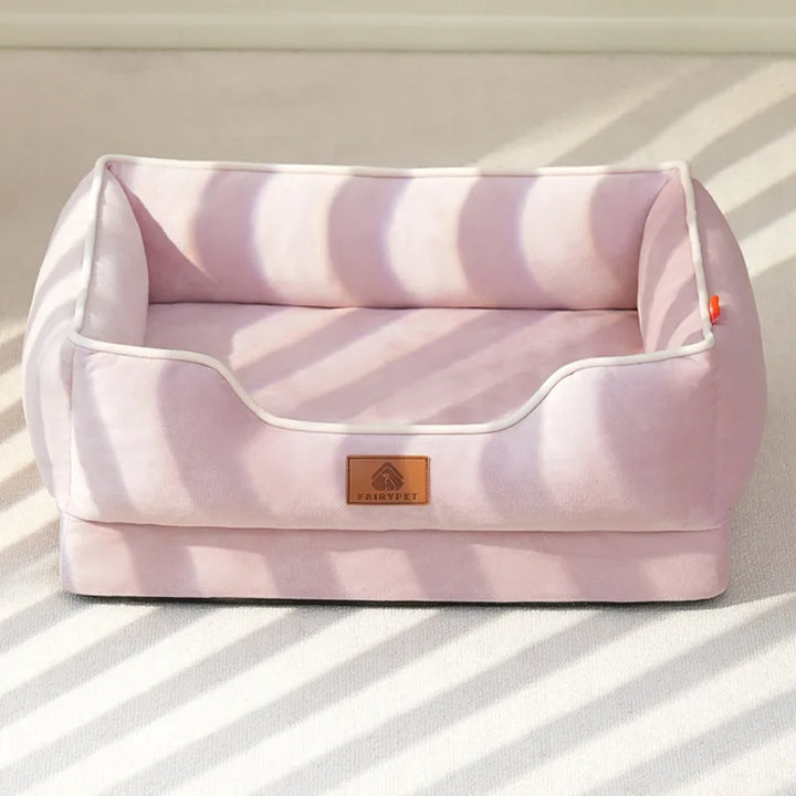 "Velvet-soft pet bed with cushion and bolster, shown in modern living room, offers comfort with Dutch velvet texture."