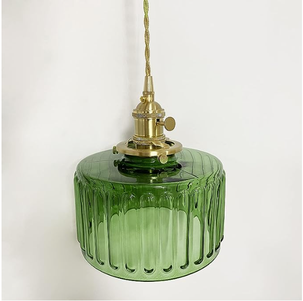 Vintage cylindrical glass pendant lamp casting warm glow; elegant centerpiece for home decor. Perfect for living and dining a