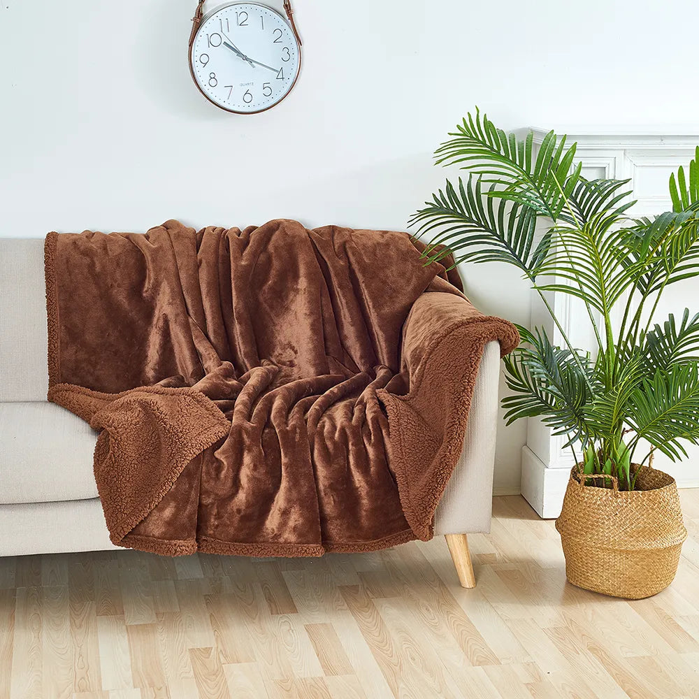 "Waterproof plush furniture protector, dual-sided, fits all sizes; soft, cozy, protects from spills and stains."