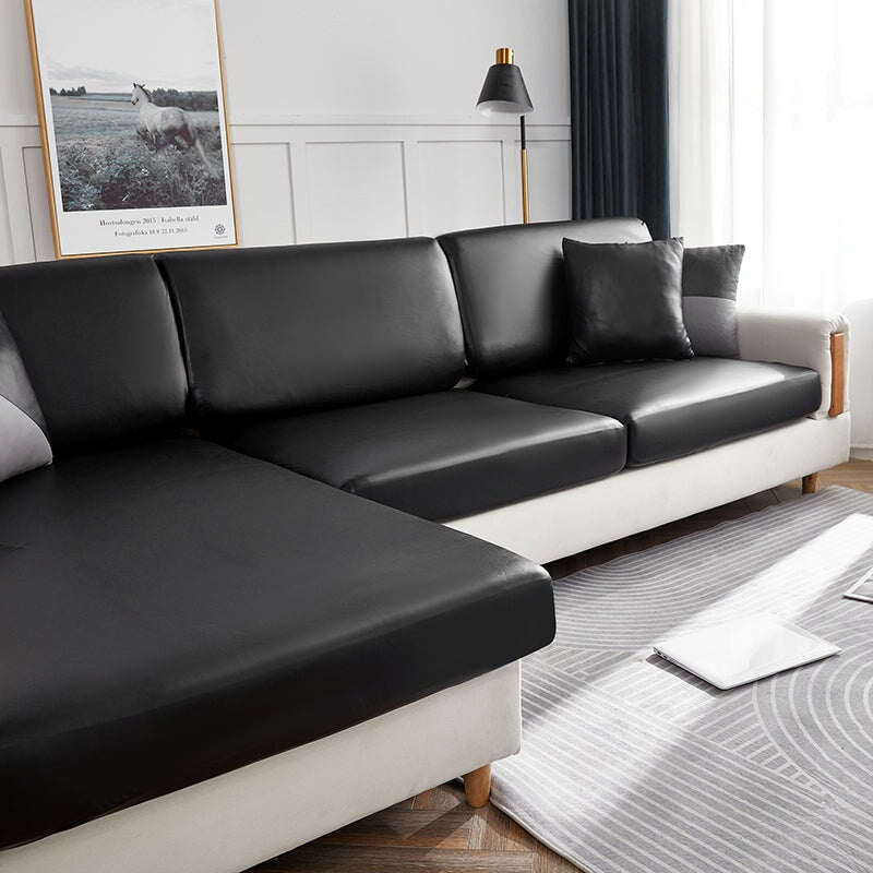 "Waterproof sectional sofa cover in smoke grey, sleek design for leather protection, durable stretchable fabric, snug fit."