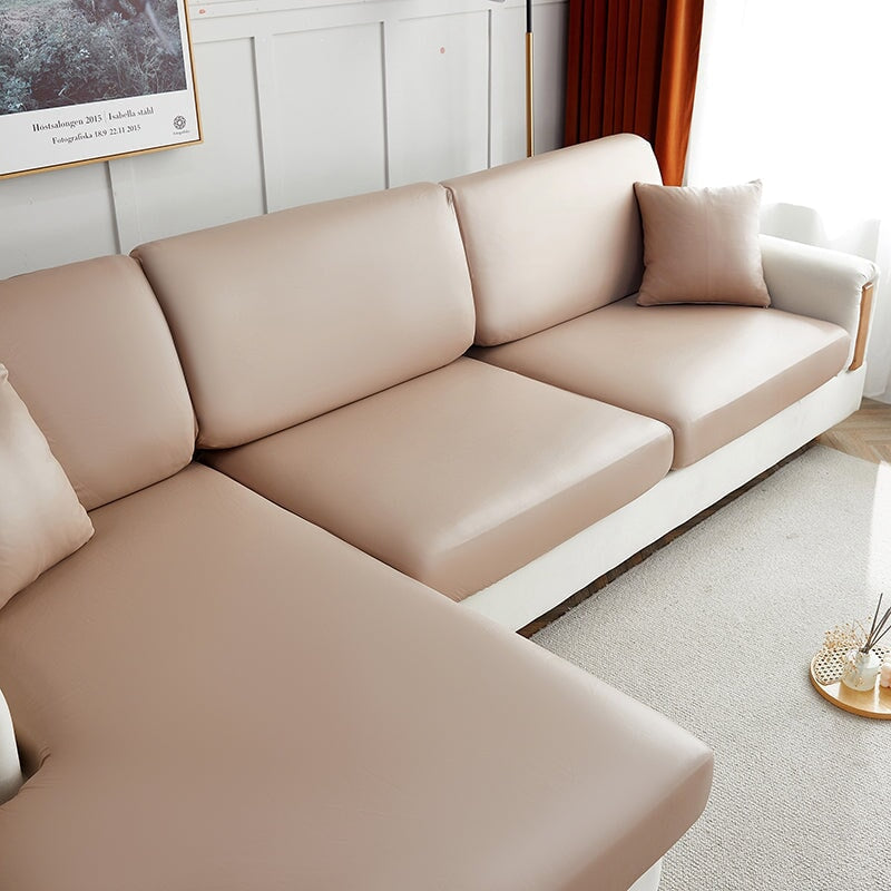 "Waterproof sectional sofa cover in smoke grey, sleek design for leather protection, durable stretchable fabric, snug fit."