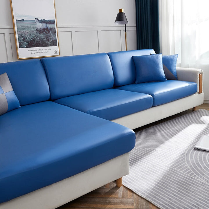 "Waterproof sectional sofa cover in smoke grey, sleek design for leather protection, durable stretchable fabric, snug fit."