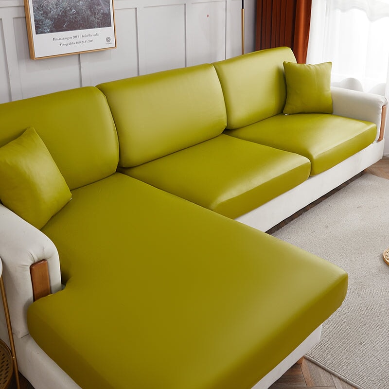 "Waterproof sectional sofa cover in smoke grey, sleek design for leather protection, durable stretchable fabric, snug fit."