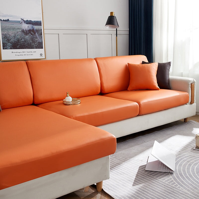"Waterproof sectional sofa cover in smoke grey, sleek design for leather protection, durable stretchable fabric, snug fit."