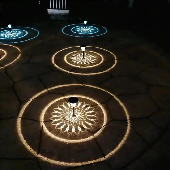 Weatherproof garden light casting intricate mandala shadows, solar-powered, LED, IP65 waterproof, enhances outdoor decor.