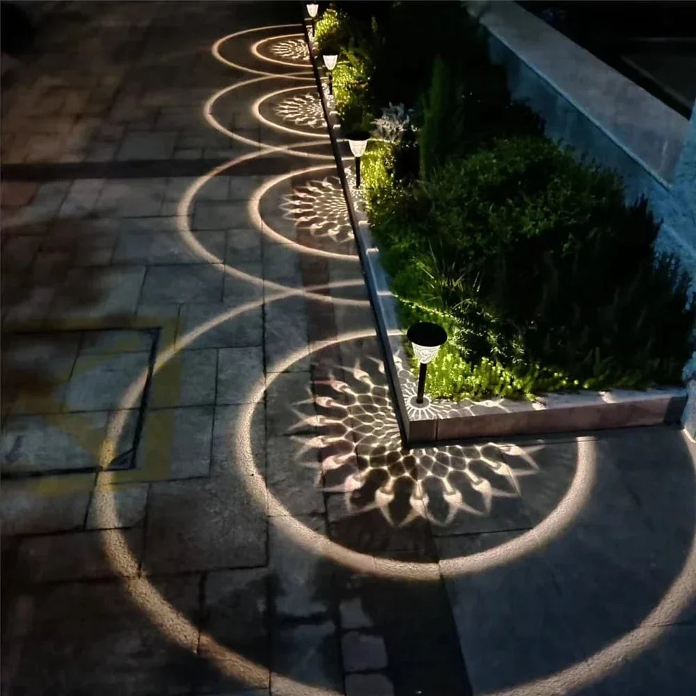 Weatherproof garden light casting intricate mandala shadows, solar-powered, LED, IP65 waterproof, enhances outdoor decor.
