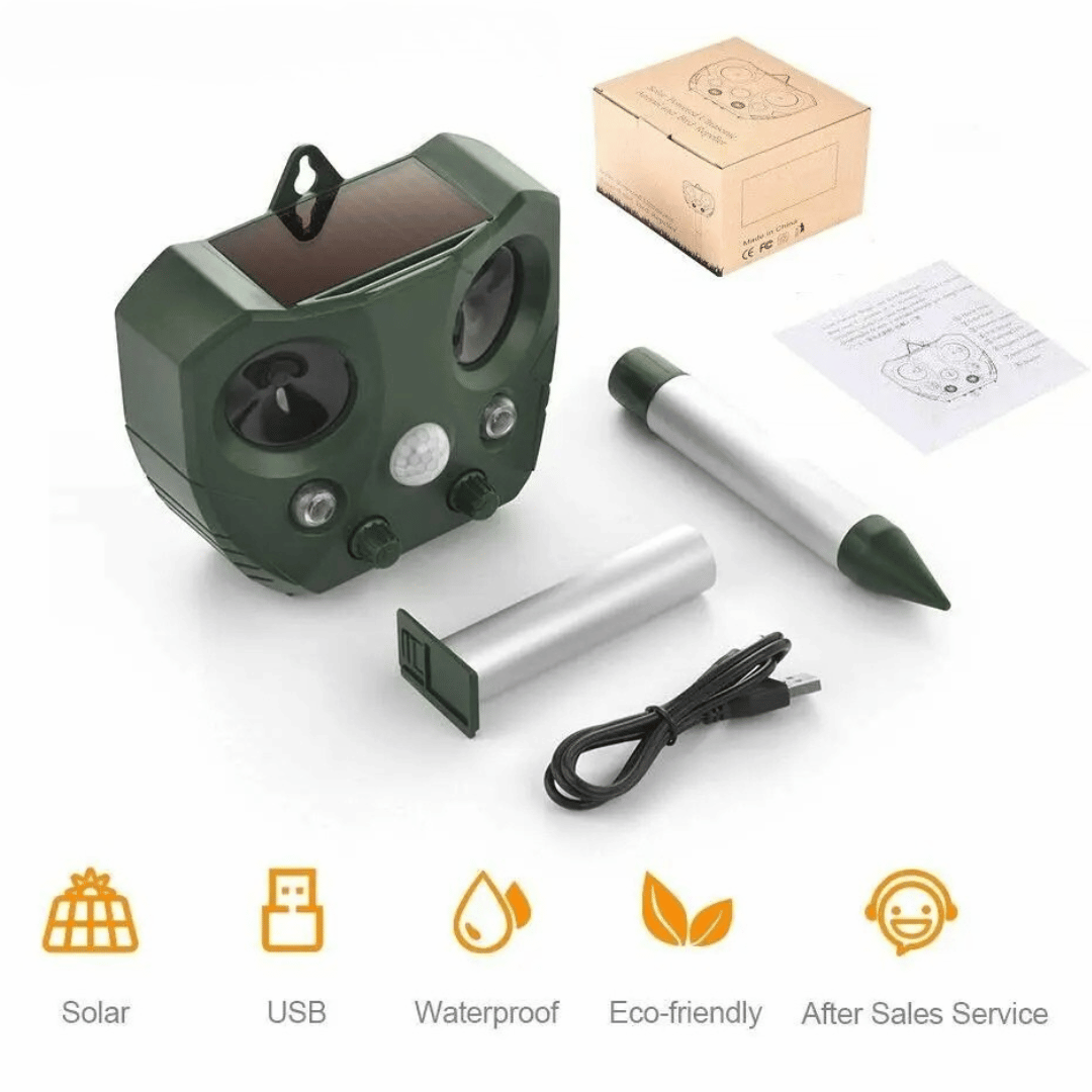 "Weatherproof solar ultrasonic animal repeller in garden, motion-activated to deter pests like cats and rodents."