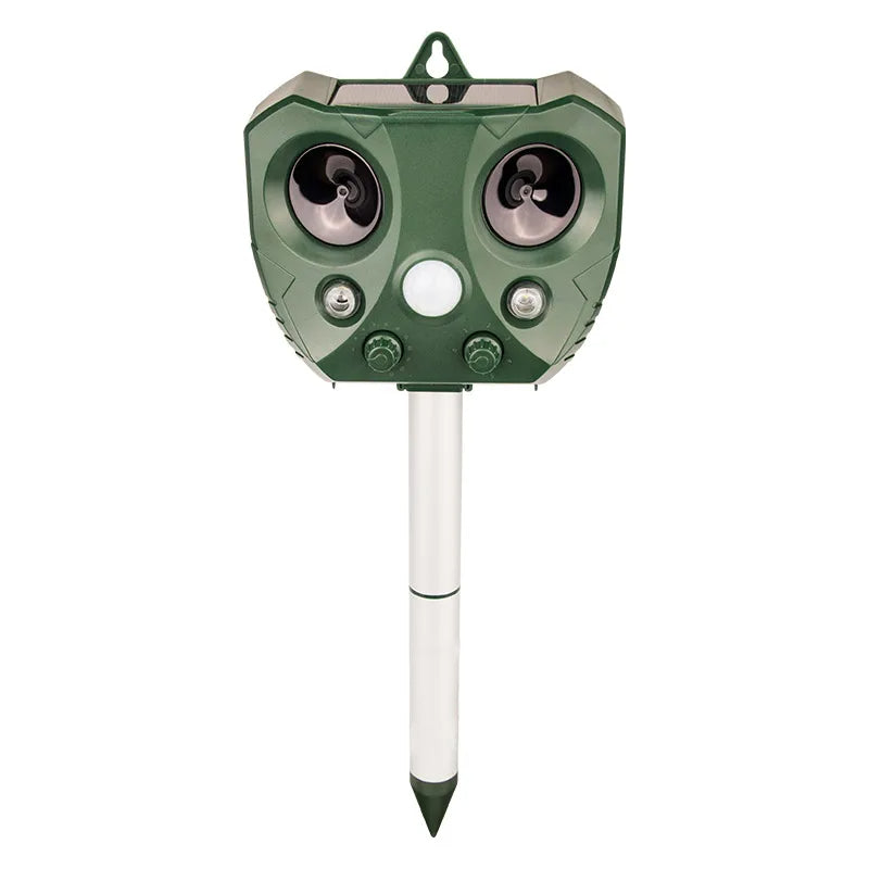 "Weatherproof solar ultrasonic animal repeller in garden, motion-activated to deter pests like cats and rodents."