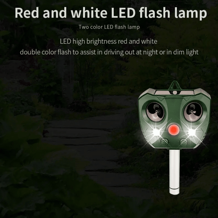"Weatherproof solar ultrasonic animal repeller in garden, motion-activated to deter pests like cats and rodents."