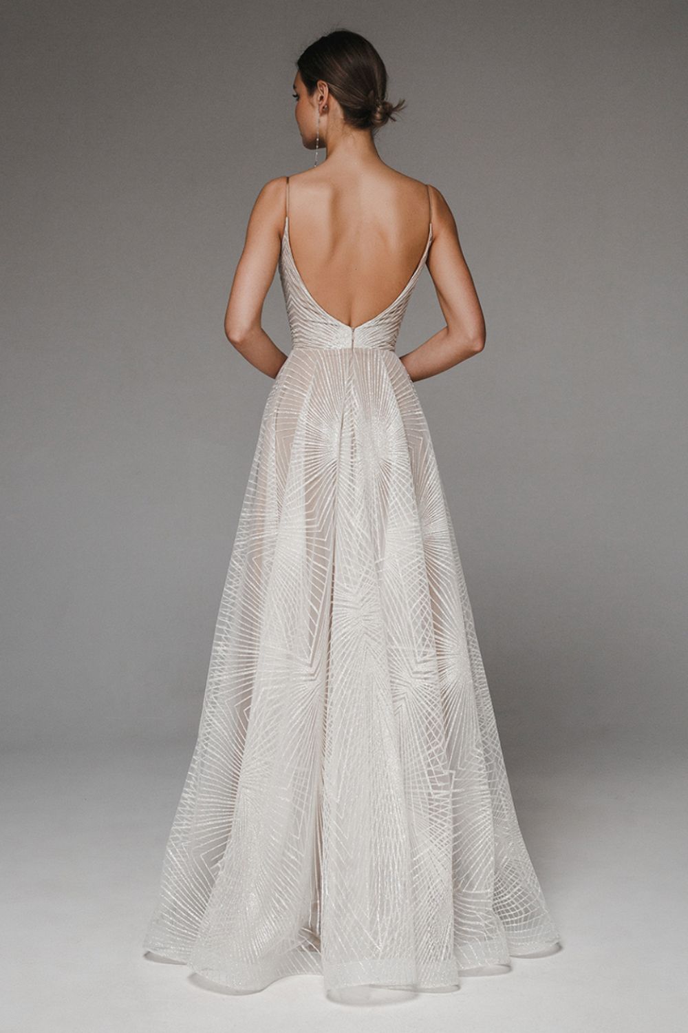 Women's A-Line evening dress with chiffon overlay, geometric pattern, and spaghetti straps, elegant for formal occasions.