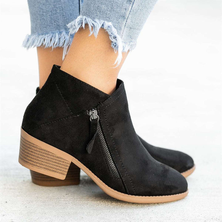 "Women's ankle length orthopedic boots with zipper, modern style, available in multiple colors for comfort and support."
