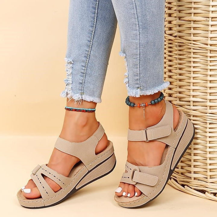 "Women's arch support sandals with adjustable straps, in beige, black, brown, and red for comfort and style."