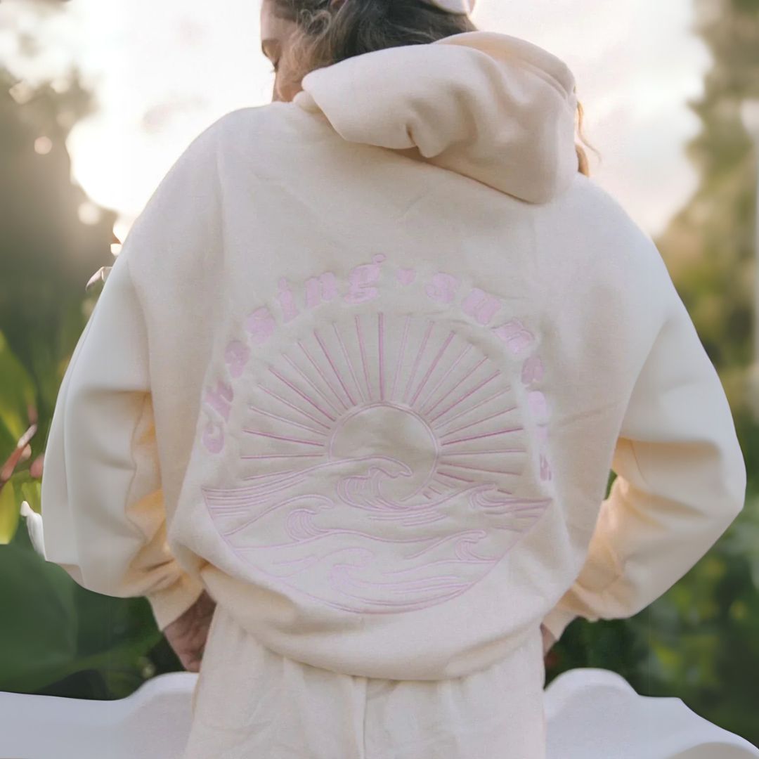 "Womens beige and pink oversized hoodie with graphic print, featuring shades of blue. Fashionable, relaxed fit for casual sty