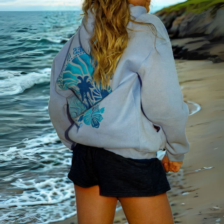 "Womens beige and pink oversized hoodie with graphic print, featuring shades of blue. Fashionable, relaxed fit for casual sty