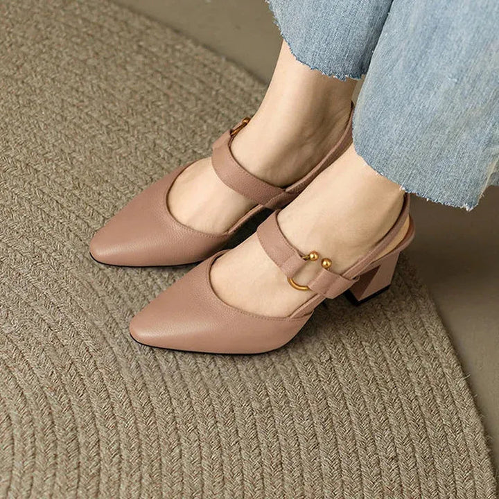 "Women's beige orthopedic high heels with wide base, offering support and style for comfort and confidence all day."
