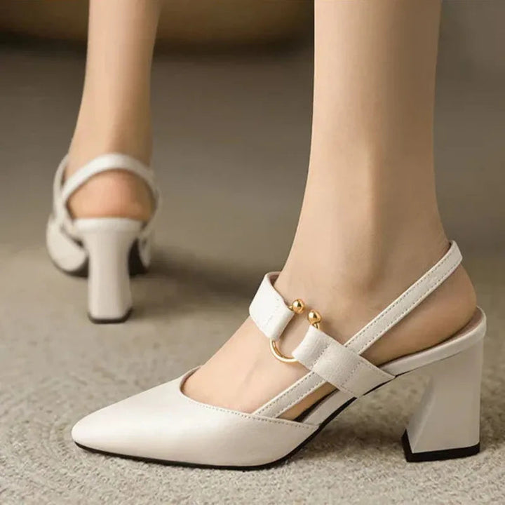 "Women's beige orthopedic high heels with wide base, offering support and style for comfort and confidence all day."