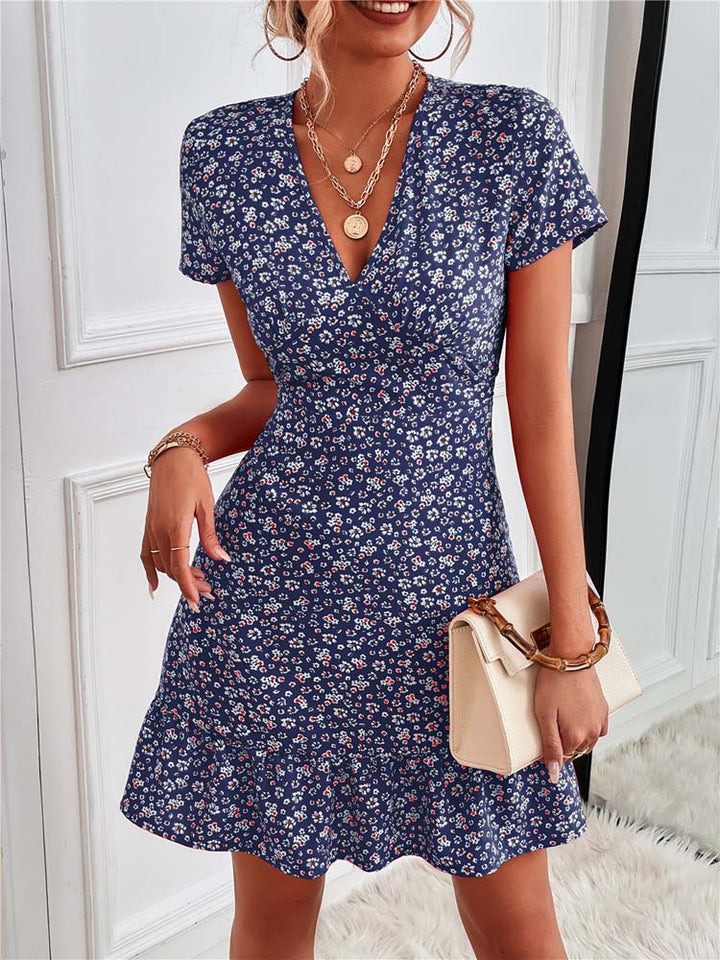 "Women's black floral V-neck mini dress, elegant style, detailed with a vibrant floral pattern for summer comfort and charm."